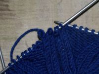 как да вратите капачката на човека с игли за плетене 15